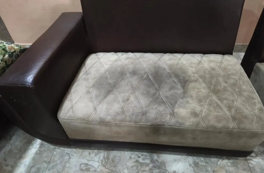 Stained sofa before dry cleaning